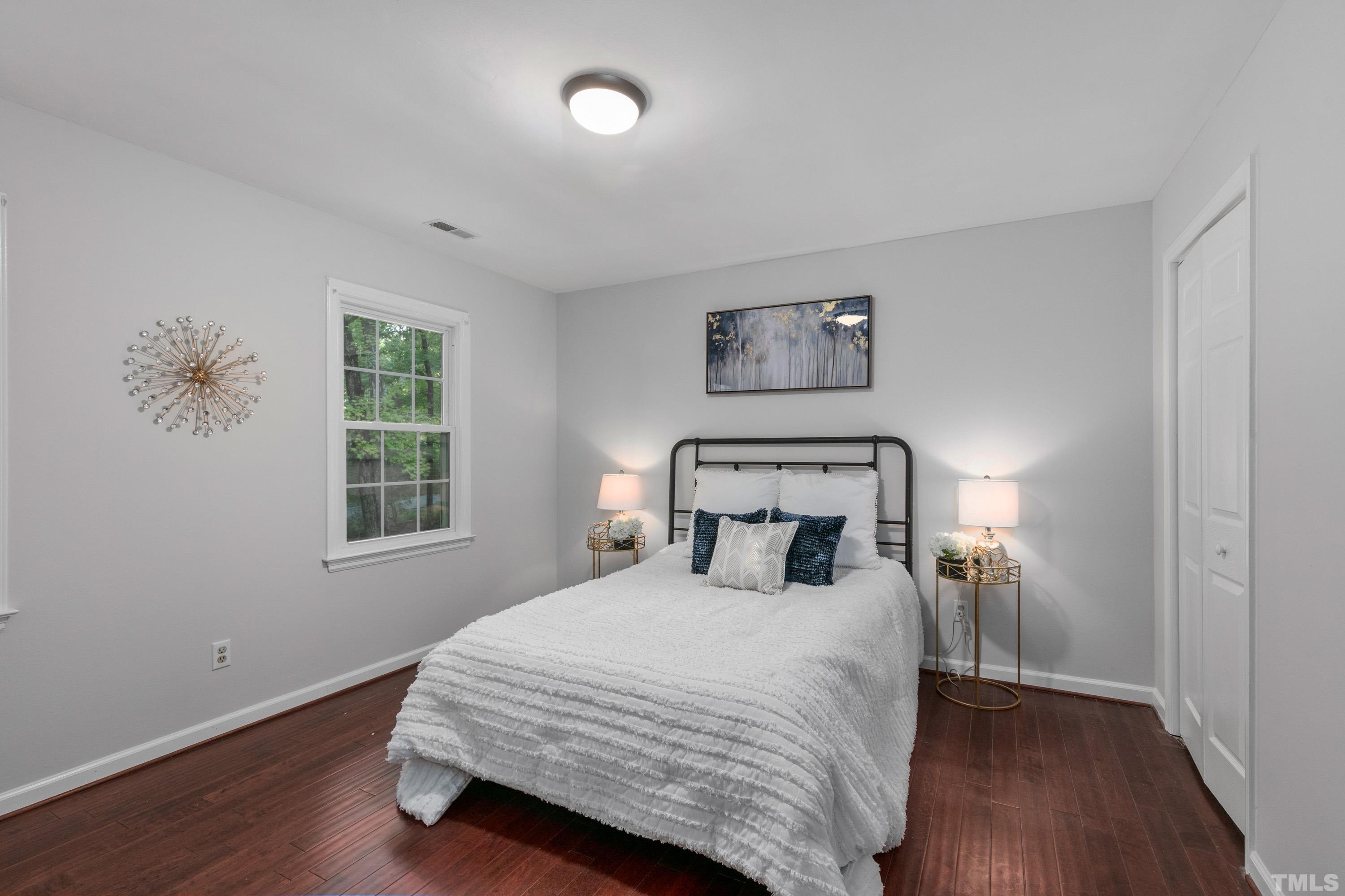 3605 Penhurst Place Raleigh, NC 27613 - Photo 22 of 30 a bedroom with a bed and a window