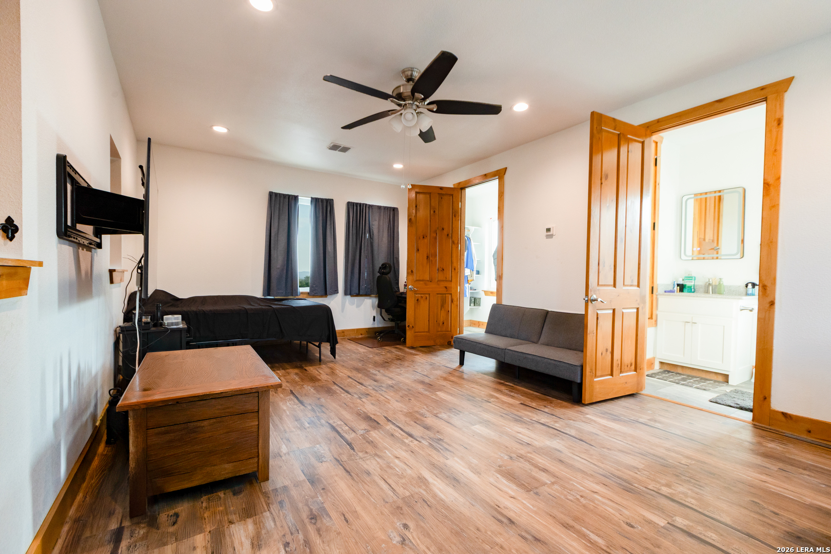 525 Windmill Drive Bandera, TX 78003 - Photo 16 of 28 a living room with furniture and a flat screen tv