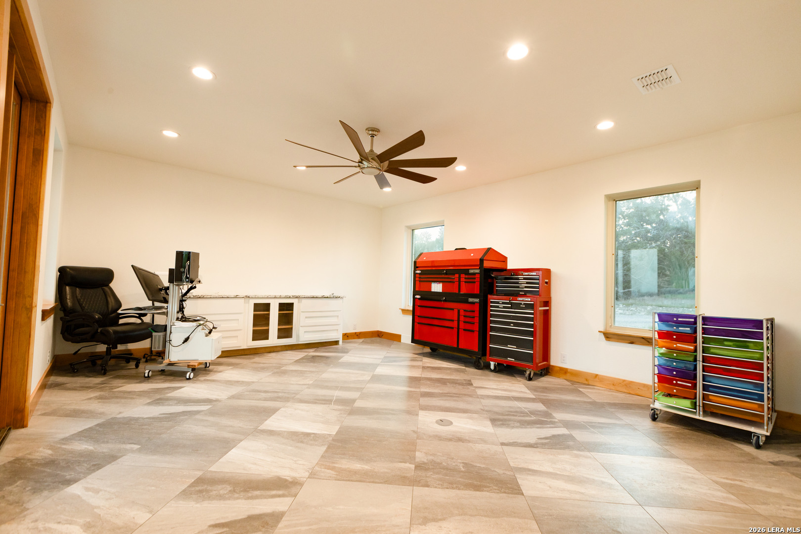 525 Windmill Drive Bandera, TX 78003 - Photo 23 of 28 a living room with furniture and a flat screen tv