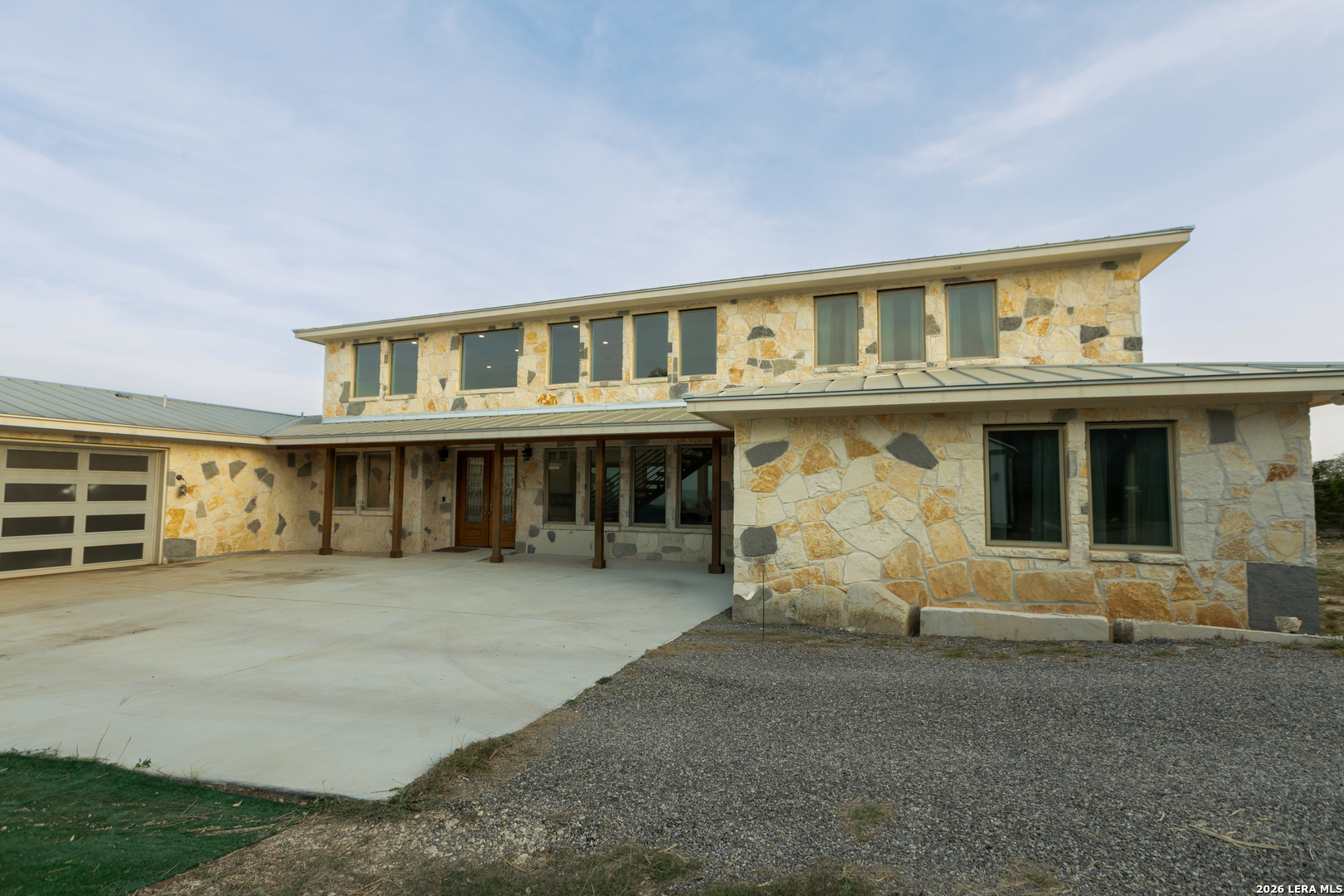 525 Windmill Drive Bandera, TX 78003 - Photo 3 of 28 a view of a house with large windows
