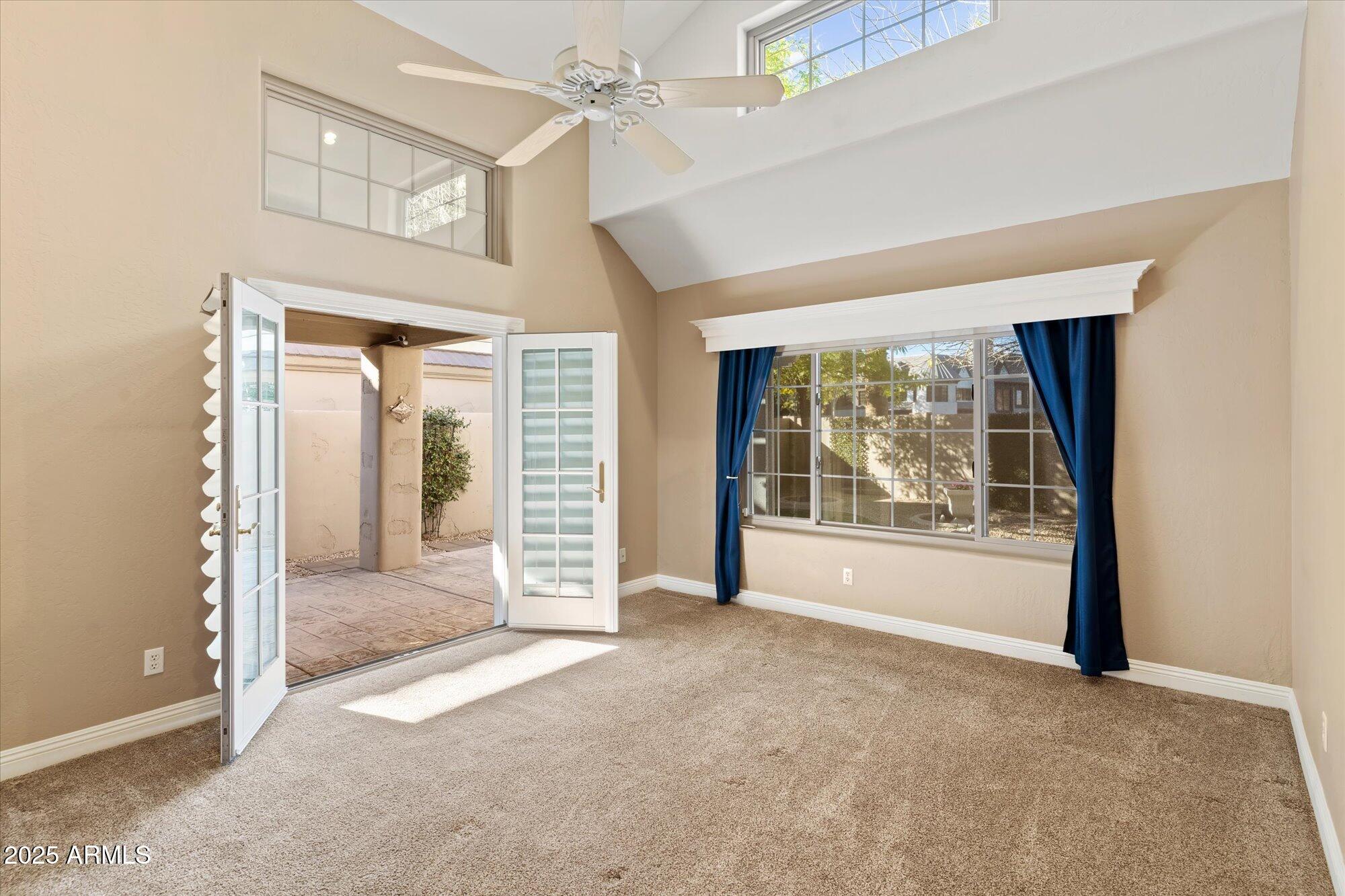 5534 North 15th Street Phoenix, AZ 85014 - Photo 14 of 25 an empty room that has a large window and doors