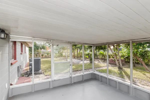 a view of an empty room with a large window