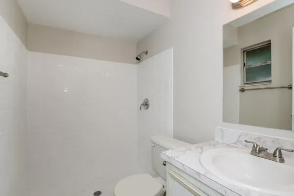 a bathroom with a sink toilet and vanity
