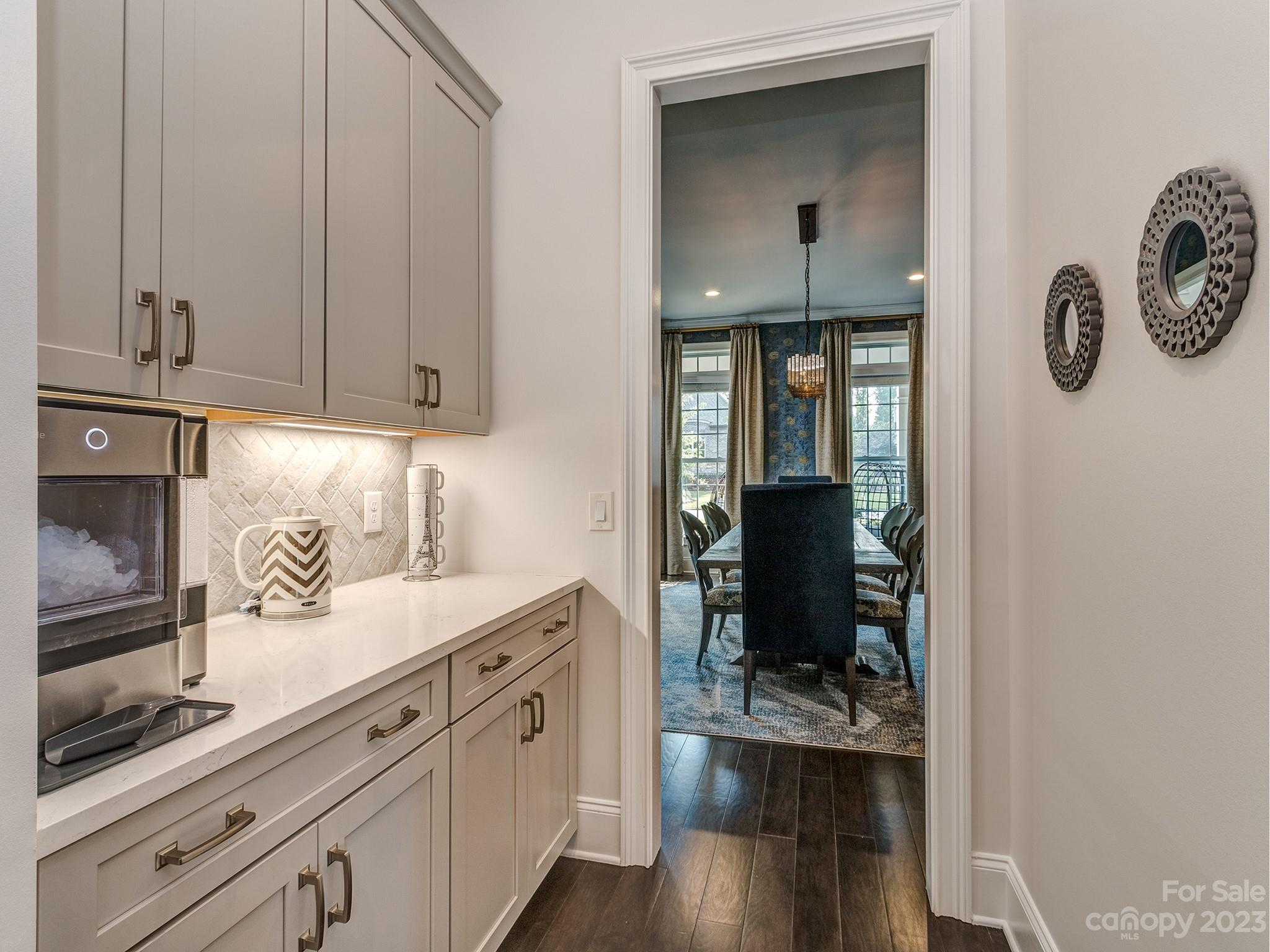 411 Turtleback Ridge Weddington, NC 28104 - Photo 12 of 48 a kitchen with a refrigerator and cabinets
