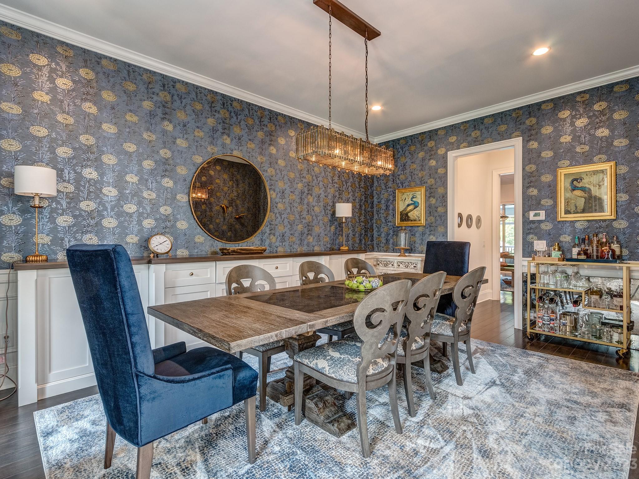 411 Turtleback Ridge Weddington, NC 28104 - Photo 18 of 48 a view of a dining room with furniture and chandelier