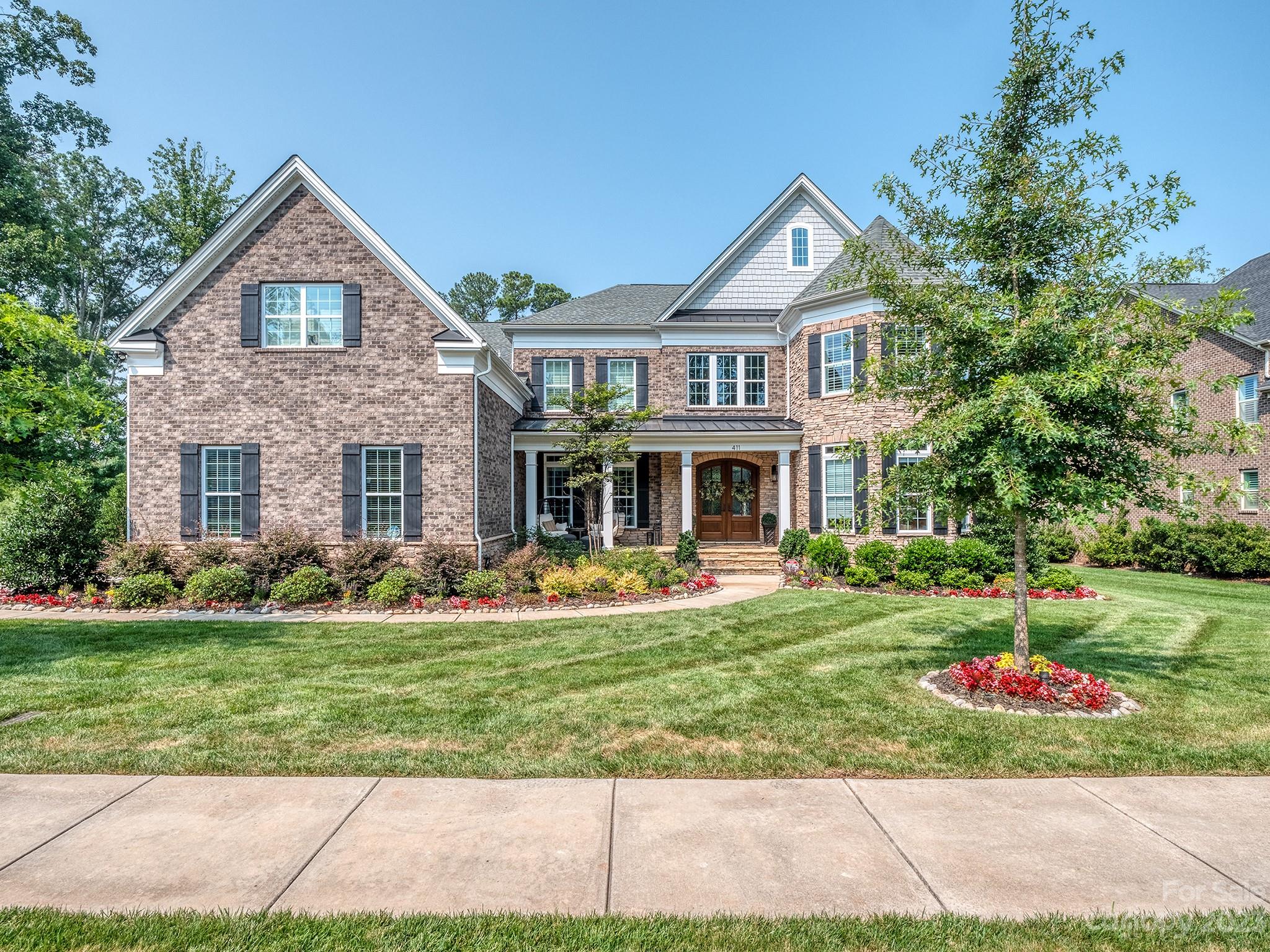 411 Turtleback Ridge Weddington, NC 28104 - Photo 2 of 48 a front view of a house with a yard