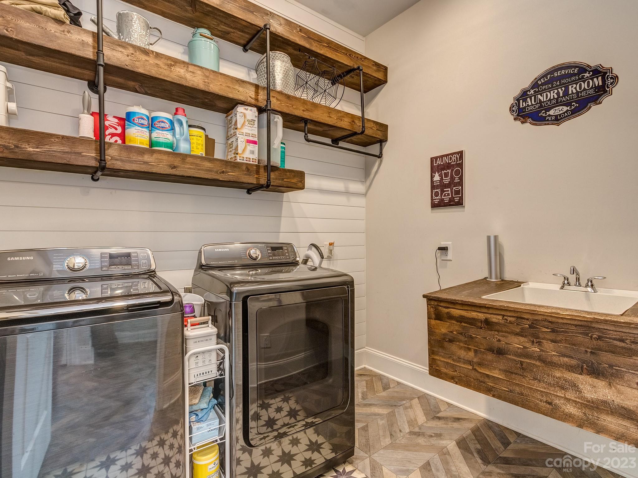 411 Turtleback Ridge Weddington, NC 28104 - Photo 22 of 48 a kitchen with stainless steel appliances granite countertop a stove and a sink
