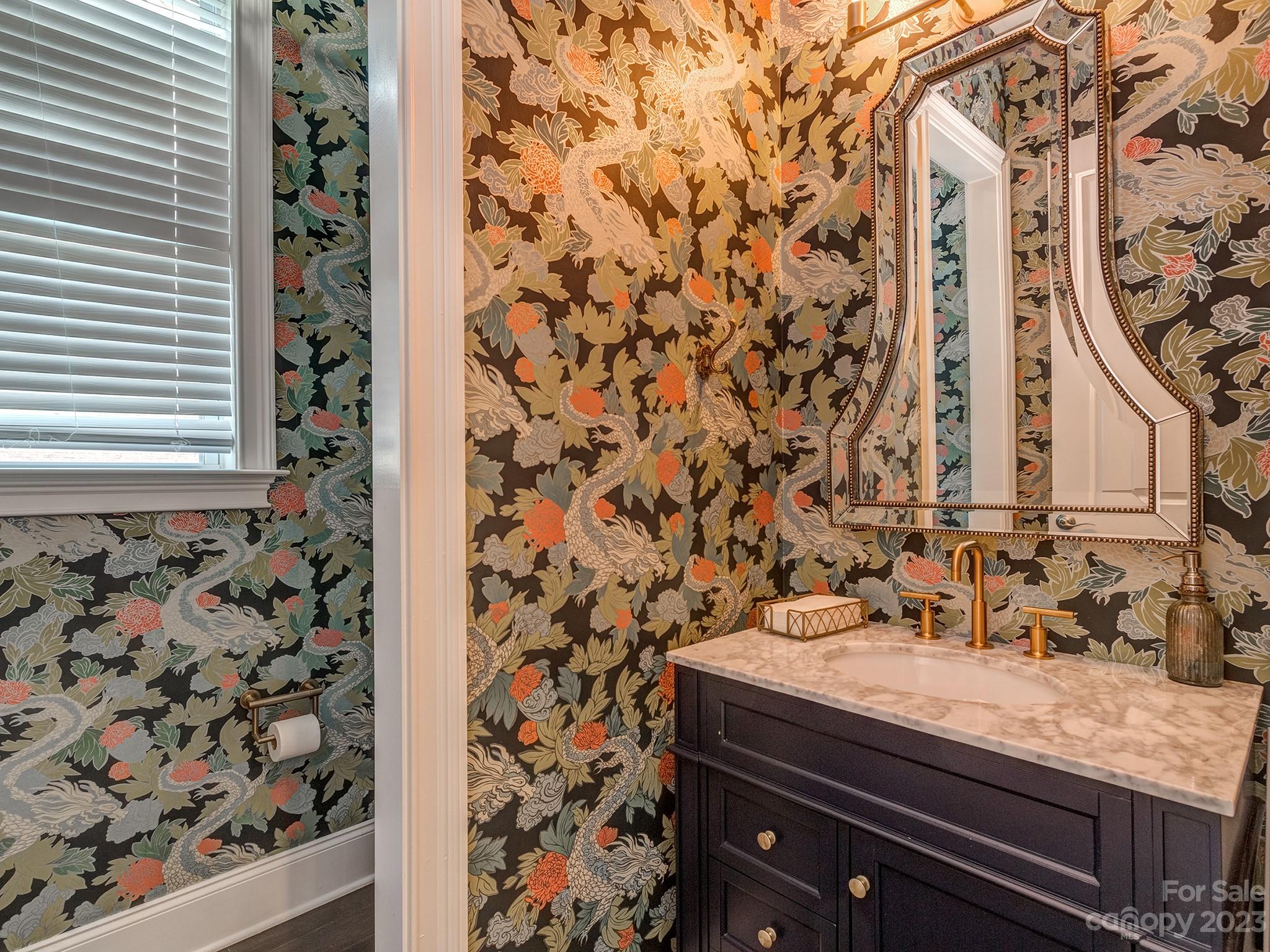 411 Turtleback Ridge Weddington, NC 28104 - Photo 23 of 48 a bathroom with a granite countertop sink a mirror and shower curtain