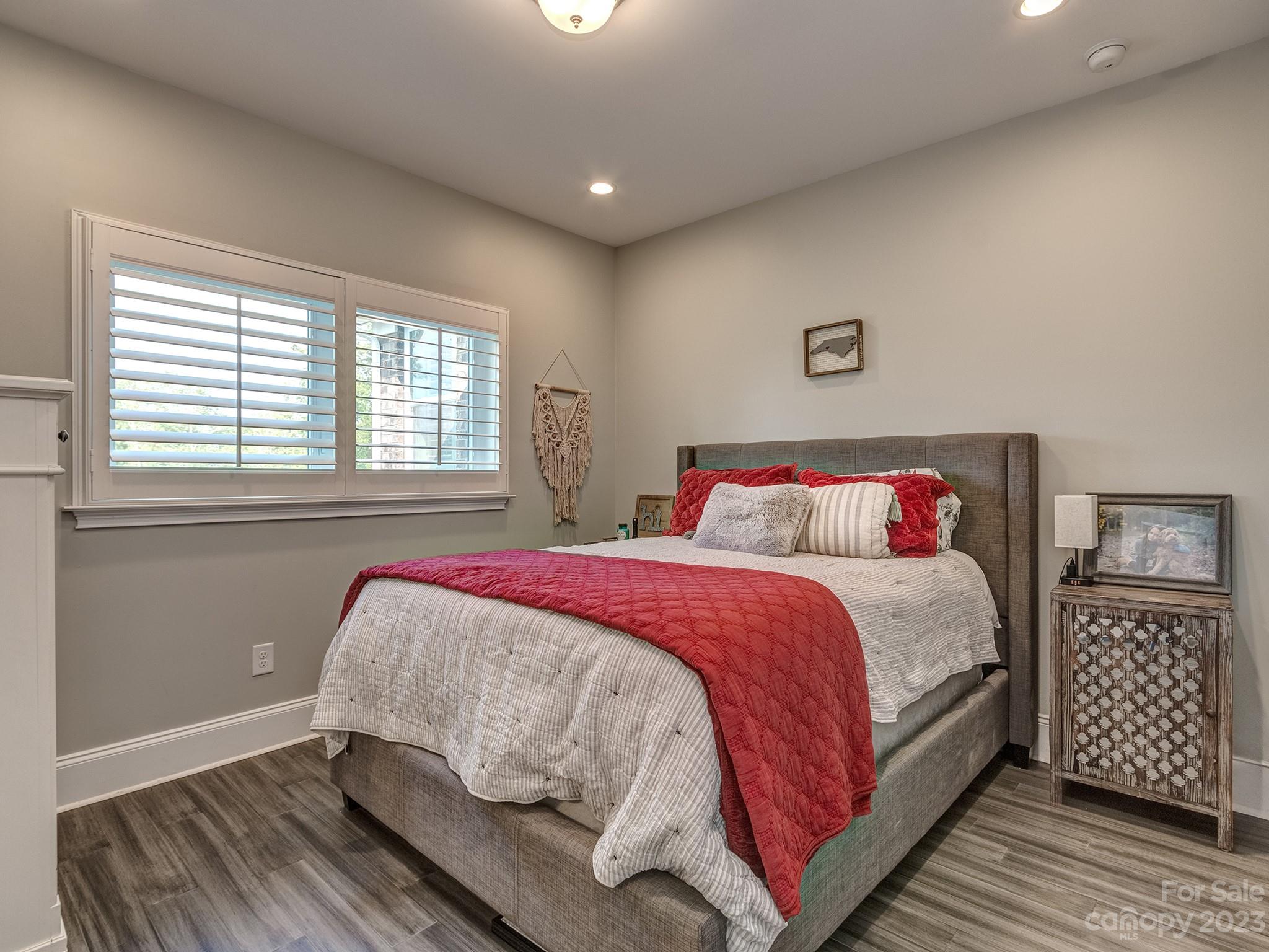 411 Turtleback Ridge Weddington, NC 28104 - Photo 28 of 48 a bedroom with a bed and wooden floor