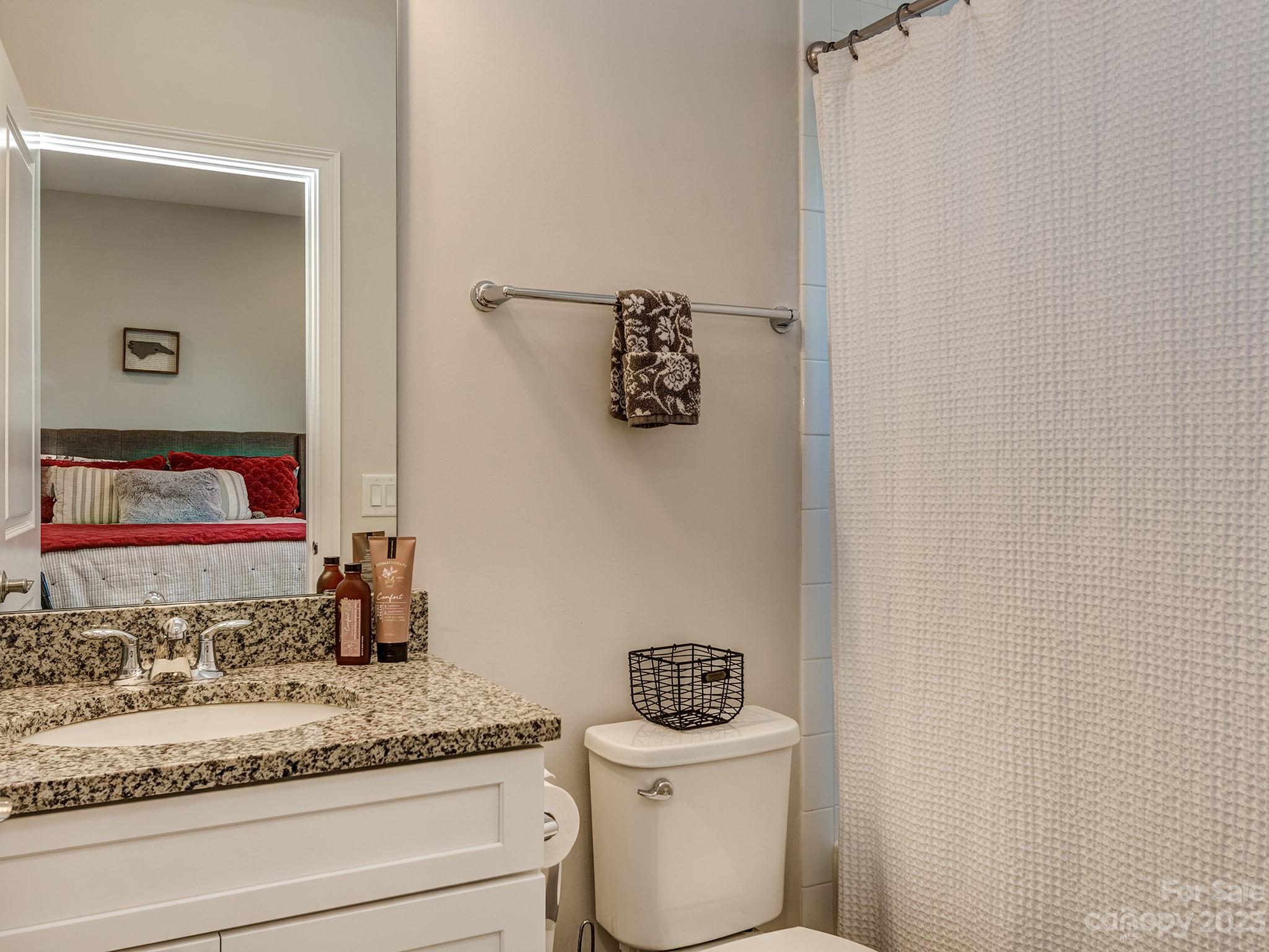 411 Turtleback Ridge Weddington, NC 28104 - Photo 29 of 48 a bathroom with a sink and a toilet