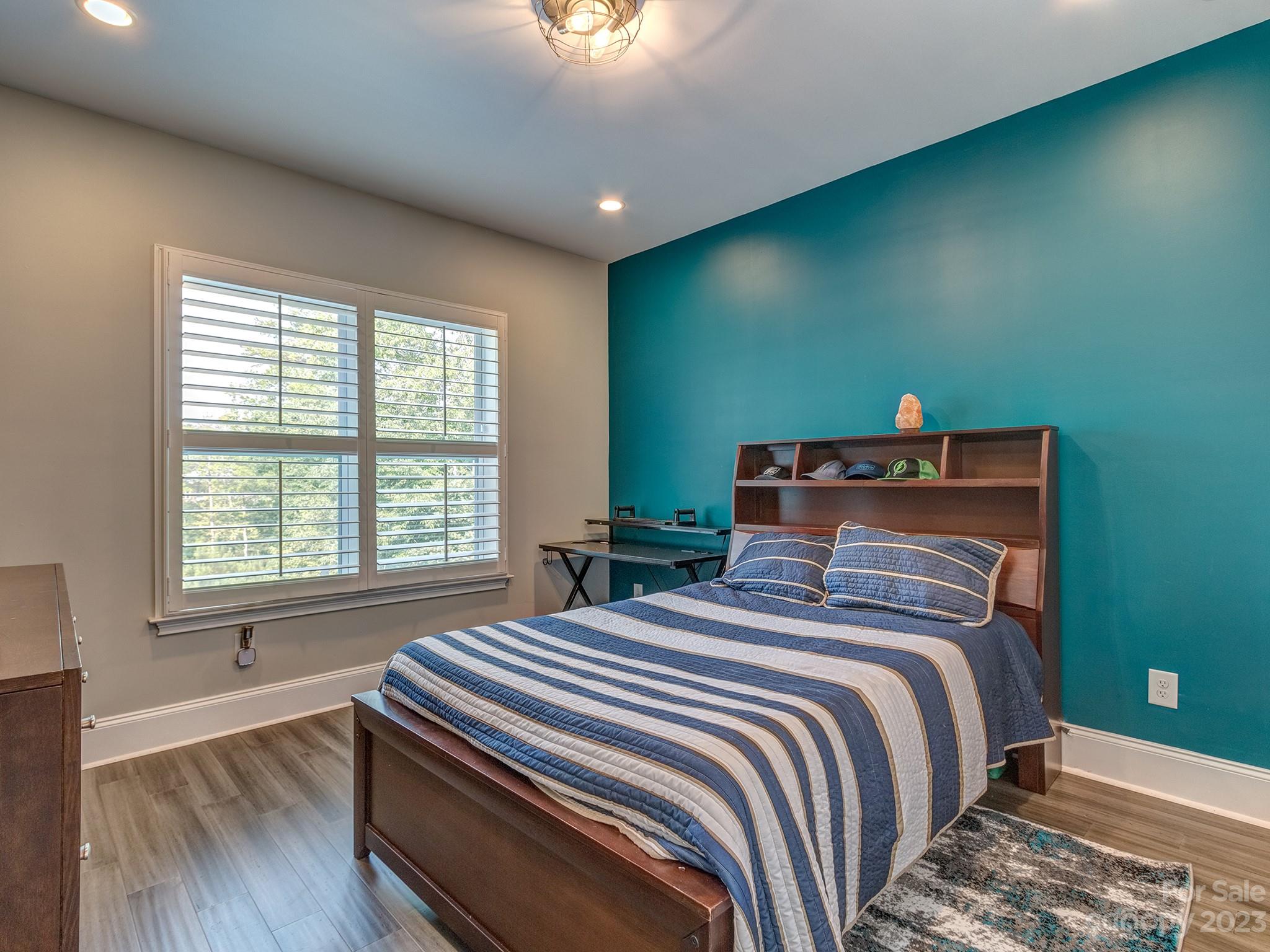 411 Turtleback Ridge Weddington, NC 28104 - Photo 30 of 48 a bedroom with a bed and a window