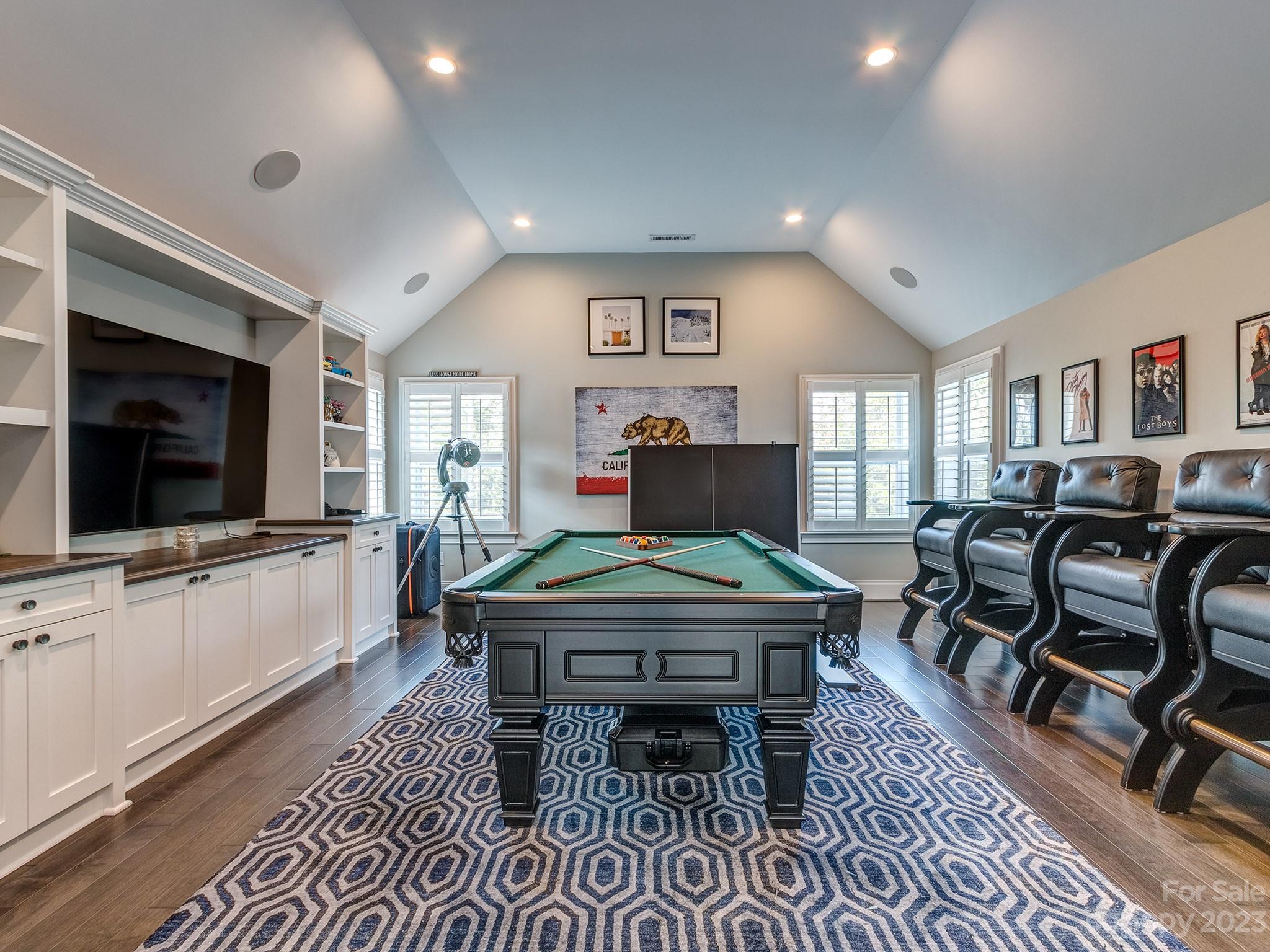411 Turtleback Ridge Weddington, NC 28104 - Photo 35 of 48 a living room with furniture a flat screen tv and kitchen view