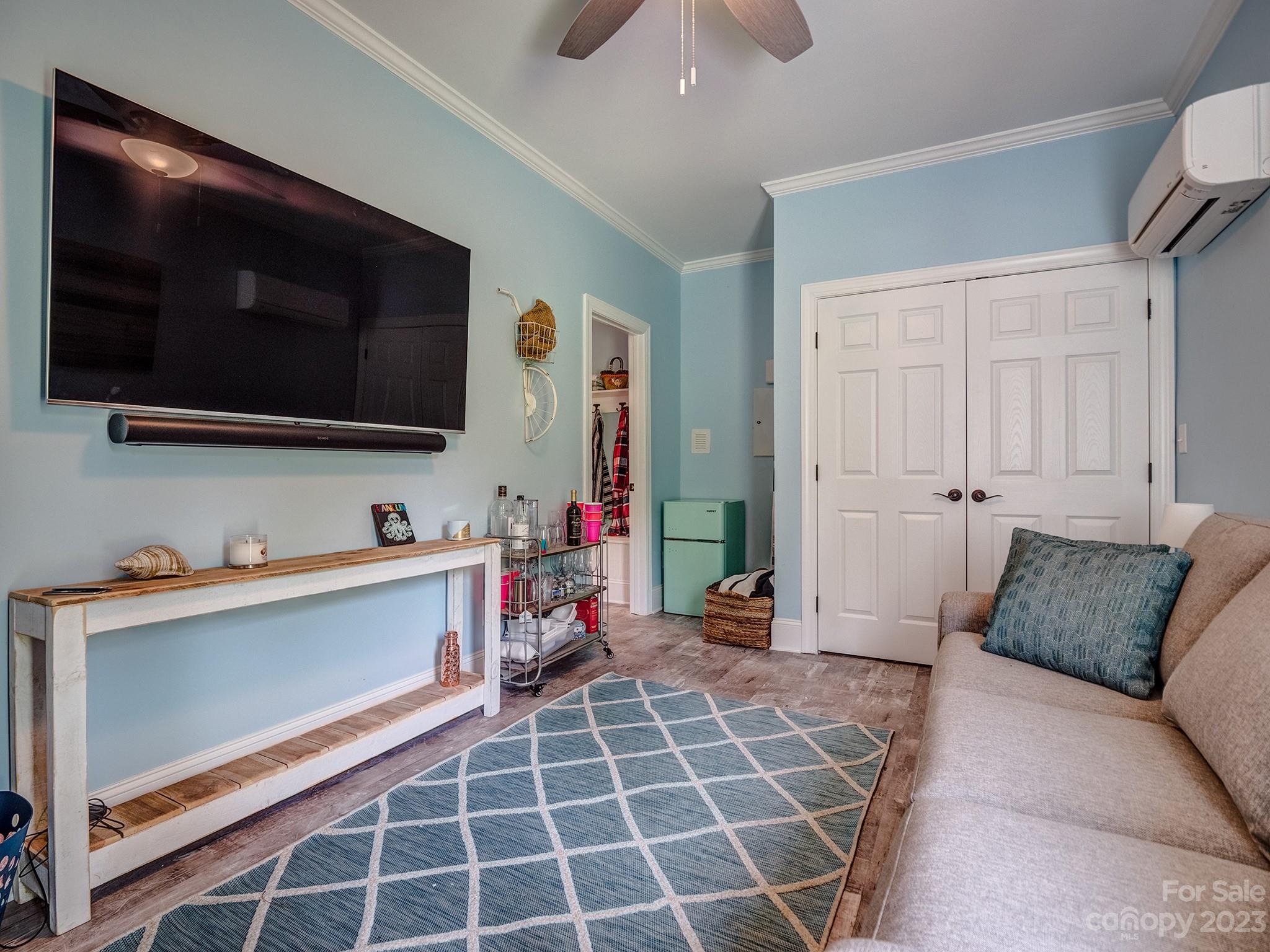 411 Turtleback Ridge Weddington, NC 28104 - Photo 38 of 48 a living room with furniture and a flat screen tv