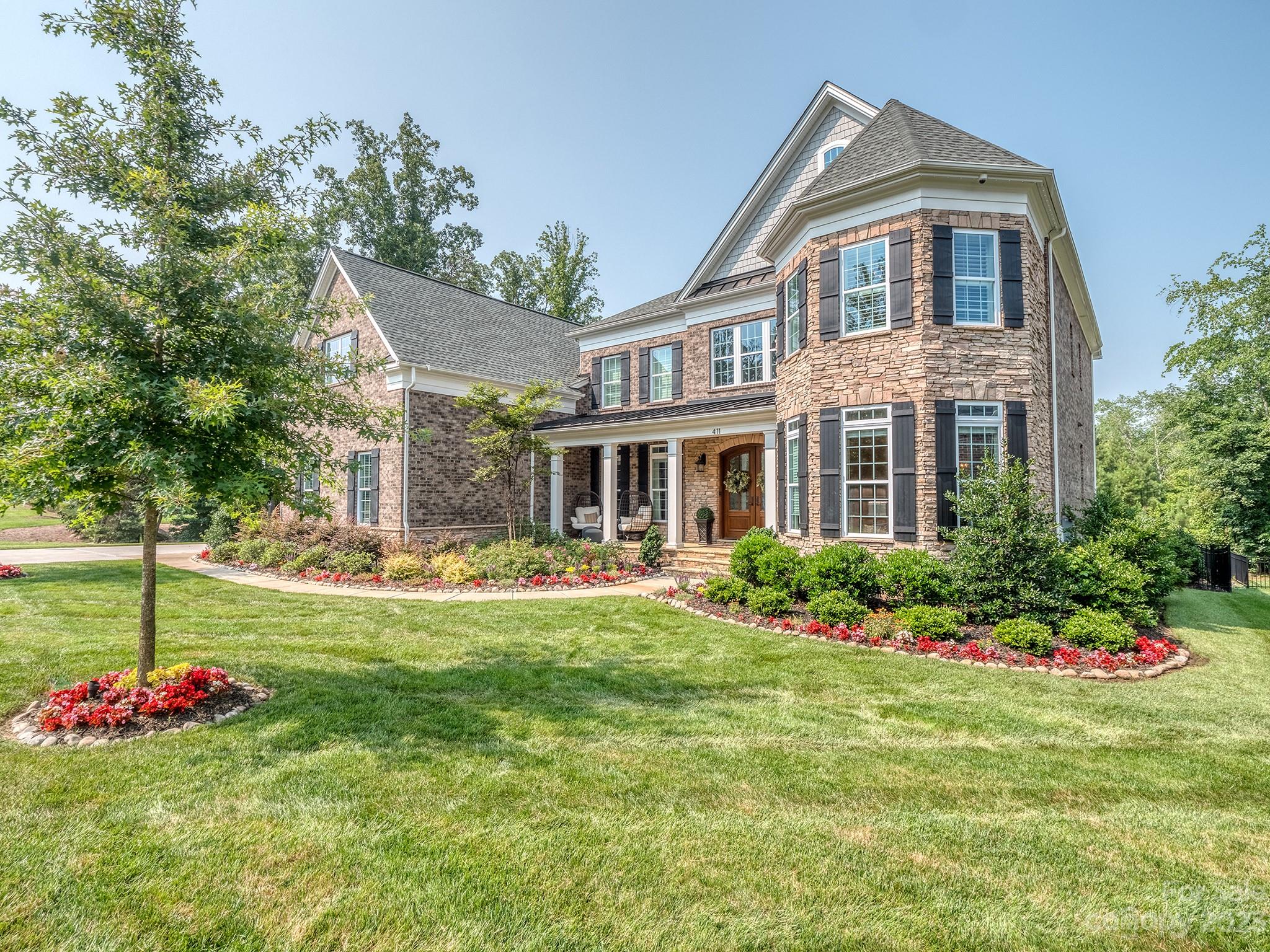 411 Turtleback Ridge Weddington, NC 28104 - Photo 4 of 48 a front view of a house with a yard