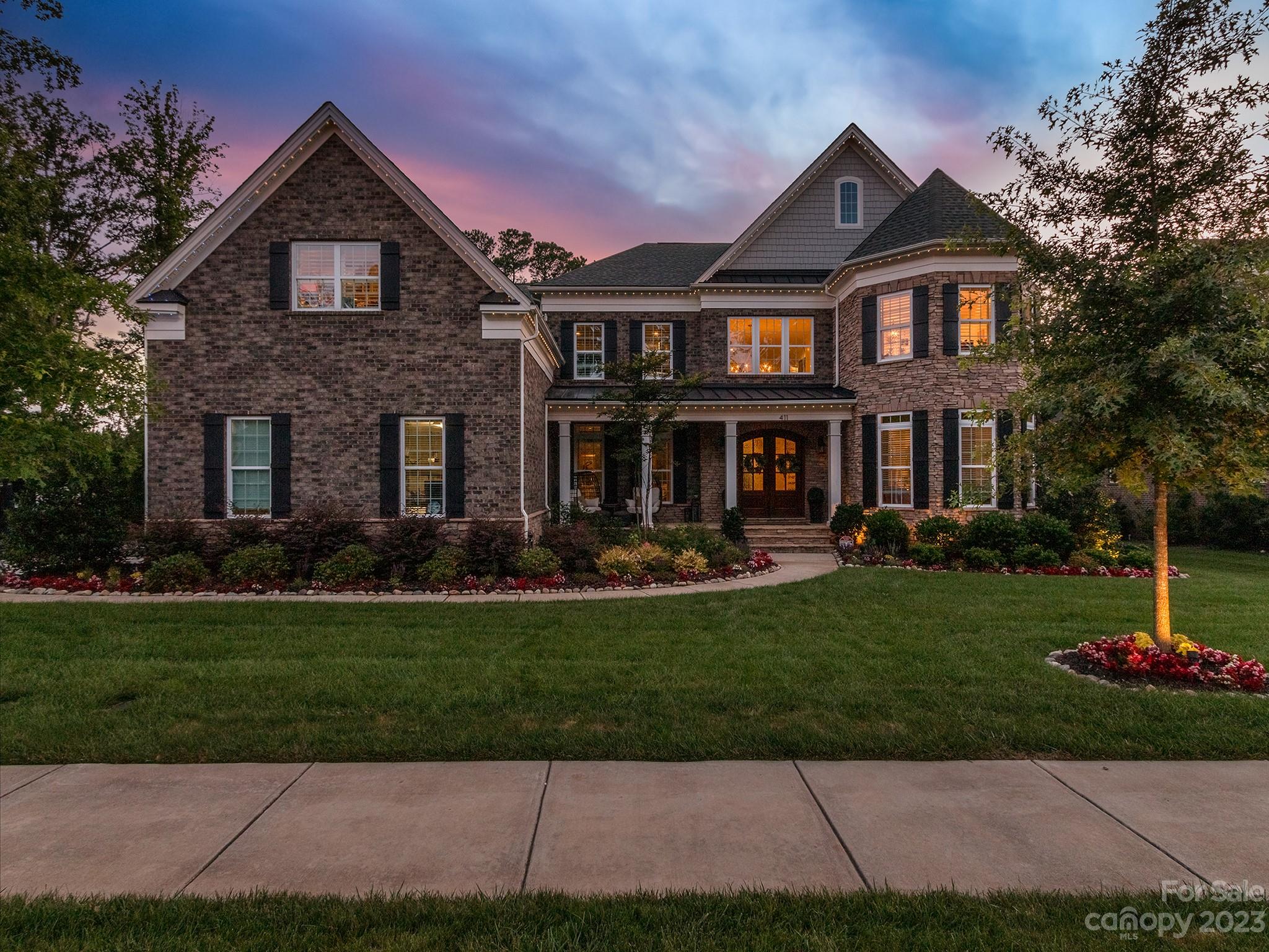 411 Turtleback Ridge Weddington, NC 28104 - Photo 45 of 48 a front view of a house with a yard