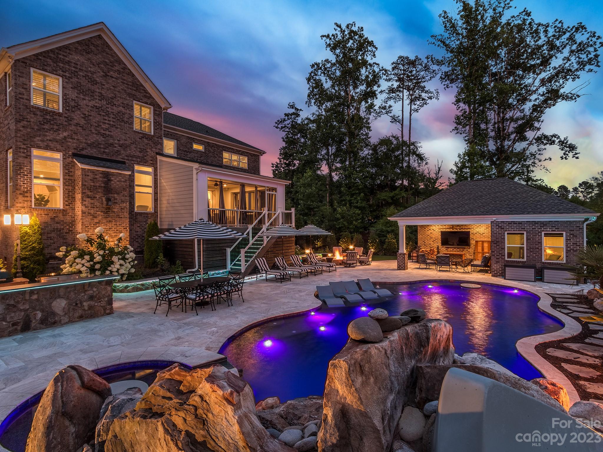 411 Turtleback Ridge Weddington, NC 28104 - Photo 46 of 48 a swimming pool view with a seating space and a potted plant