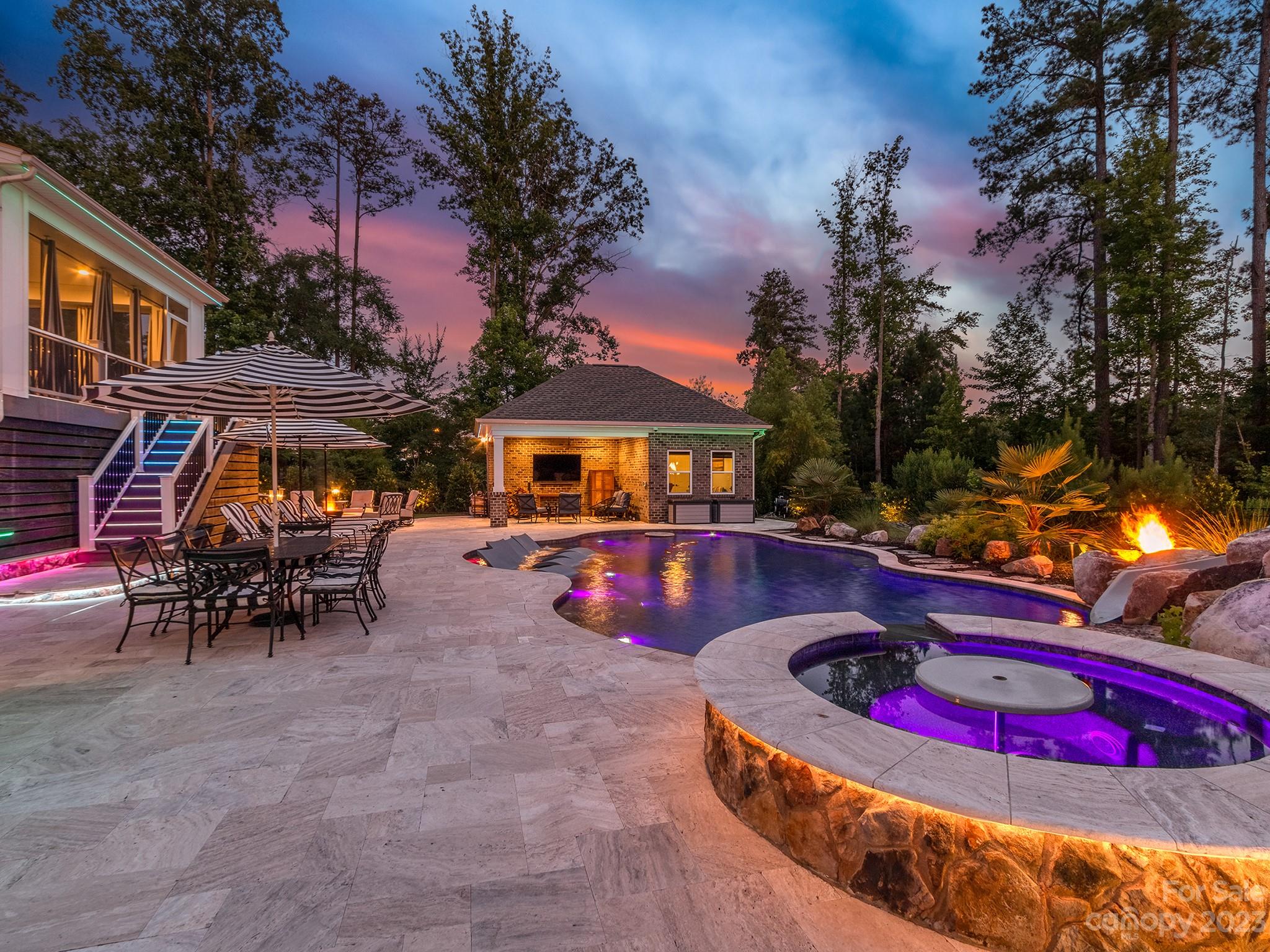 411 Turtleback Ridge Weddington, NC 28104 - Photo 48 of 48 a view of a chairs and table in backyard