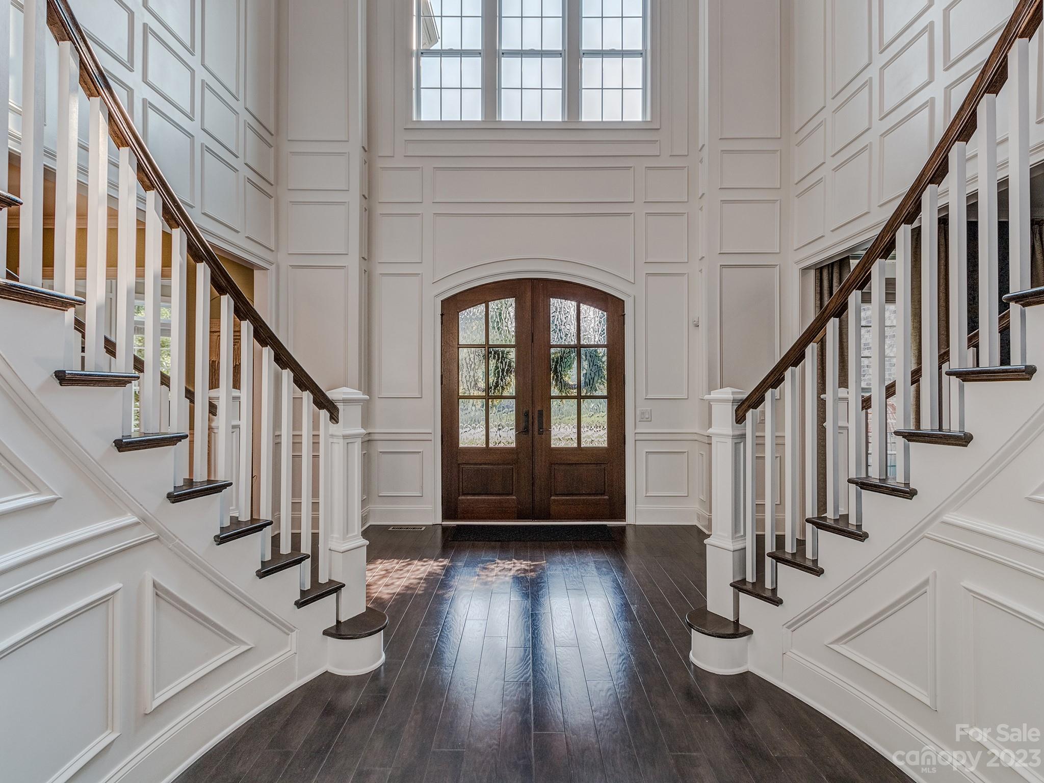 411 Turtleback Ridge Weddington, NC 28104 - Photo 5 of 48 a view of entryway with wooden floor and stairs