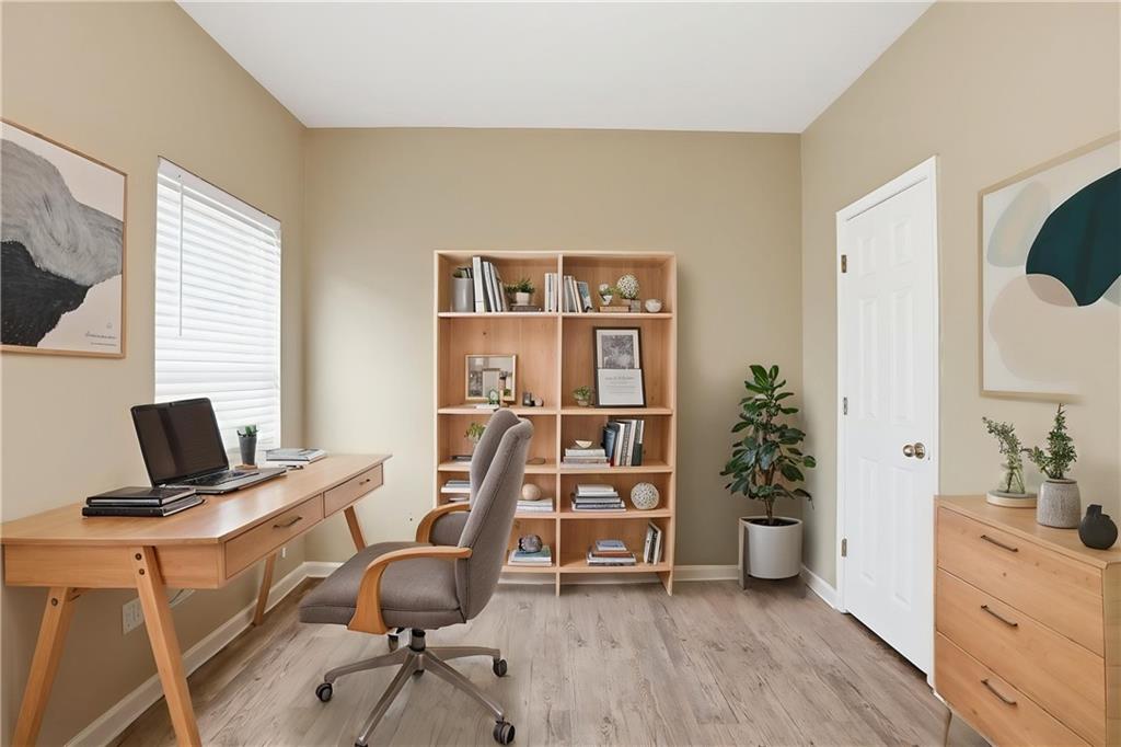 4968 Locherby Drive Fairburn, GA 30213 - Photo 4 of 39 a view of a workspace with furniture and a window