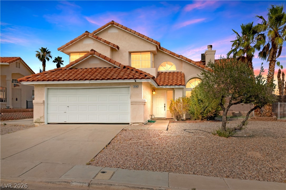3156 Terrace View Drive Laughlin, NV 89029 - Photo 1 of 94 Mediterranean-inspired facade with terracotta tile roofing and xeriscaped front yard.