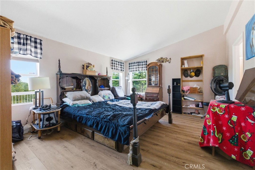 21552 Sprague Road West Groveland, CA 95321 - Photo 11 of 36 a bedroom with a bed couch and a window