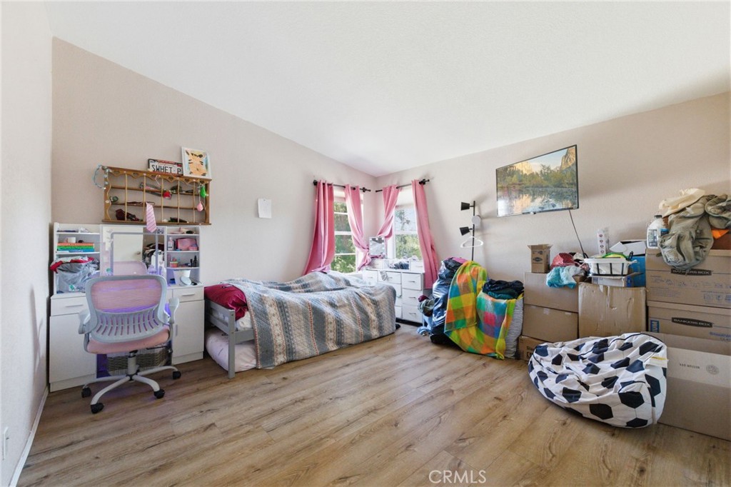 21552 Sprague Road West Groveland, CA 95321 - Photo 15 of 36 a bedroom with furniture and a chair