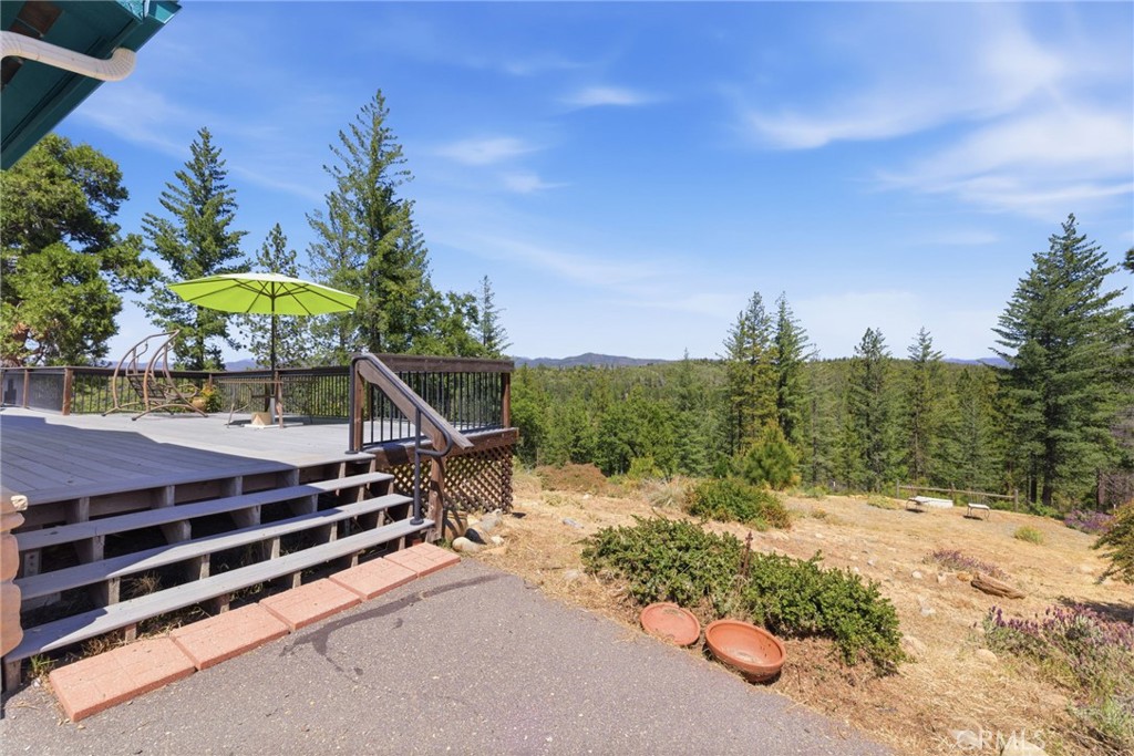 21552 Sprague Road West Groveland, CA 95321 - Photo 16 of 36 a backyard of a house with a yard and outdoor seating
