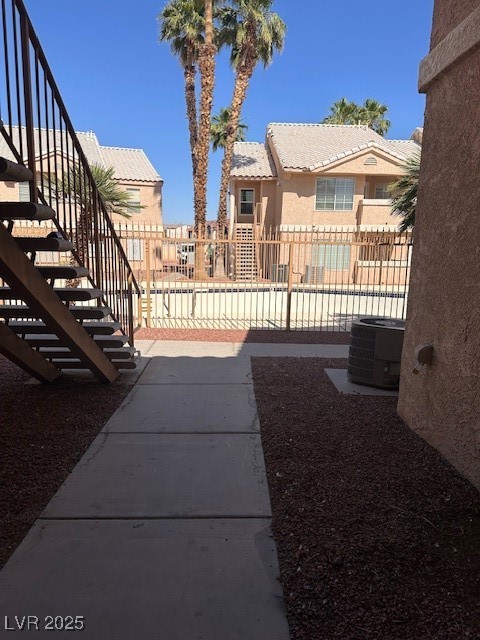 1830 North Pecos Road, Unit 155 Las Vegas, NV 89115 - Photo 3 of 23 View of yard with stairs, central air condition un