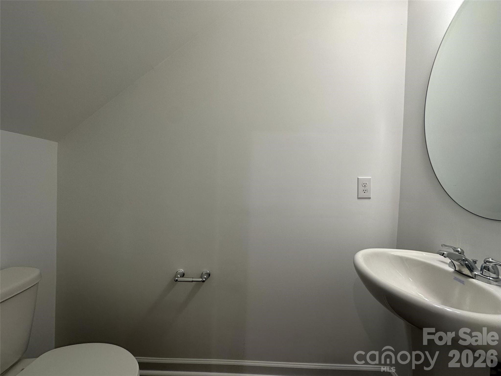 1872 Teachers House Road Northwest Concord, NC 28027 - Photo 8 of 14 a bathroom with a toilet a sink and mirror