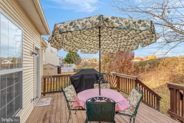 a view of balcony with wooden floor