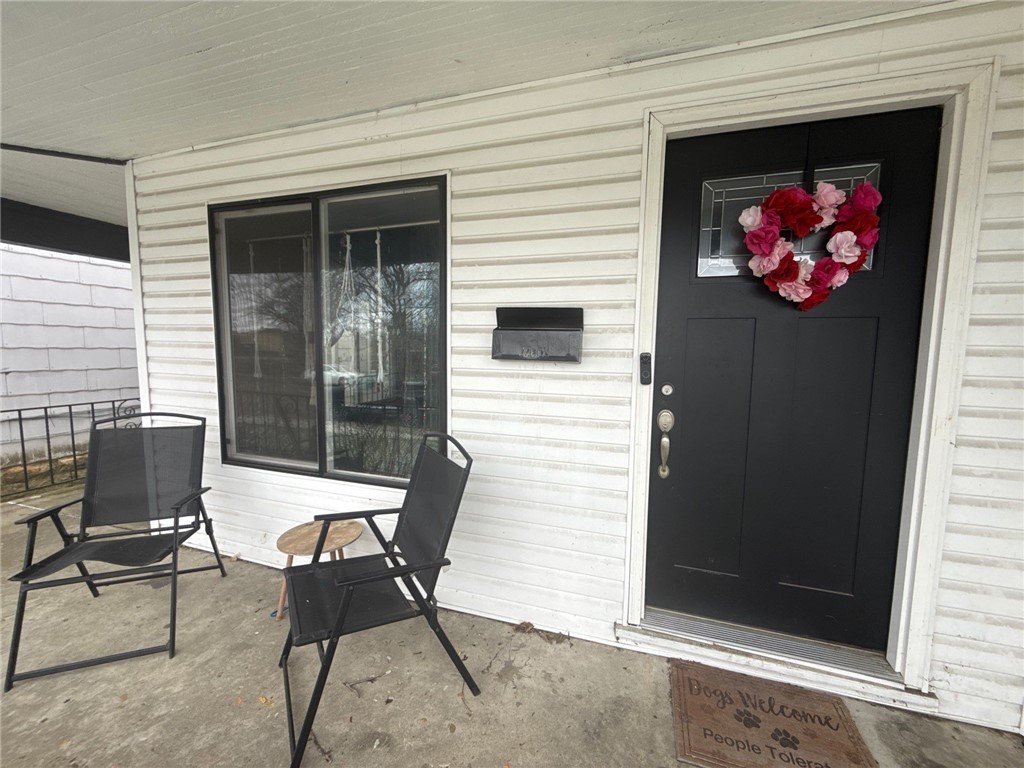 1125 West High Street Springfield, OH 45506 - Photo 38 of 39 This charming entrance features durable siding and a welcoming porch for serene outdoor moments.