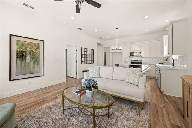 a living room with furniture and a rug