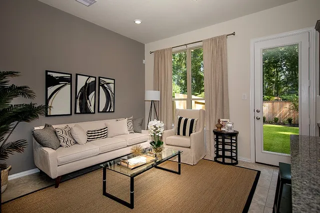 a living room with furniture and a window
