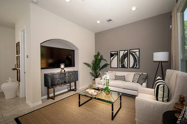 a living room with furniture and a flat screen tv
