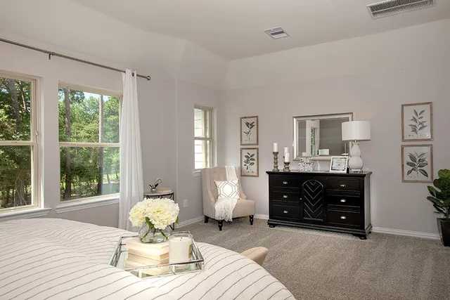 a living room with furniture a chandelier and a window