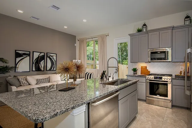 a kitchen with counter top space cabinets and stainless steel appliances