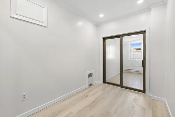 a view of an empty room with a window