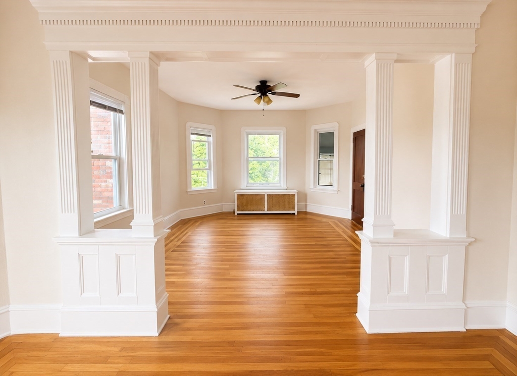 37 Shawmut Street Fall River, MA 02720 - Photo 7 of 16 a view of empty room with wooden floor and fan