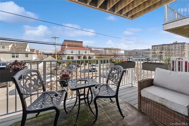 a view of a balcony with furniture