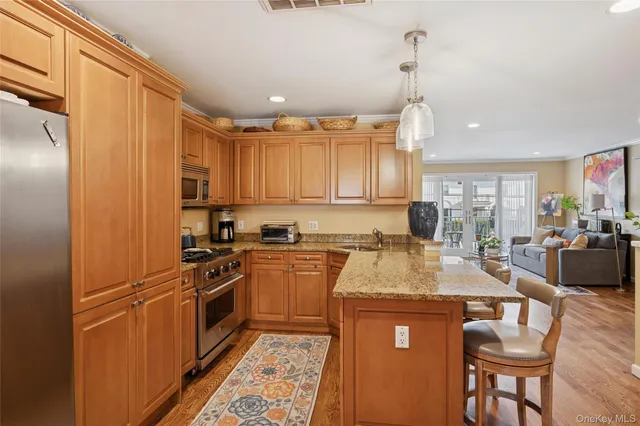 a view of a chairs and table in the patio