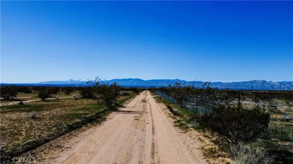 a view of a large body of water with a building in the background