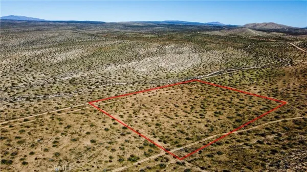 a view of a balcony with wooden floor and city view