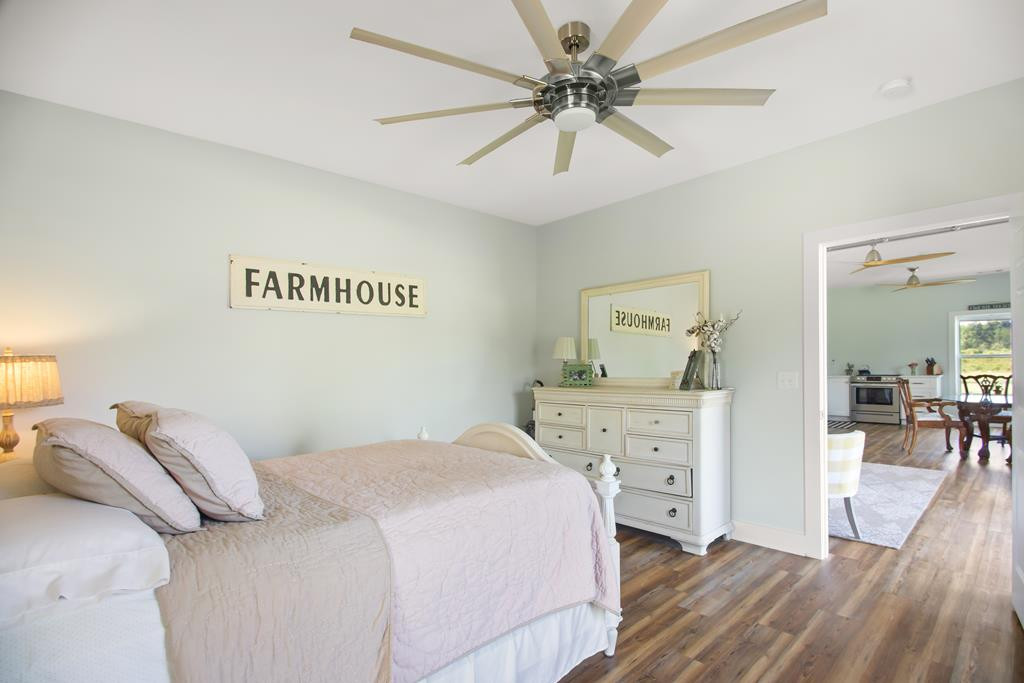 775 Colbert Bridge Road Windsor, SC 29856 - Photo 17 of 33 a bedroom with a bed and a chandelier