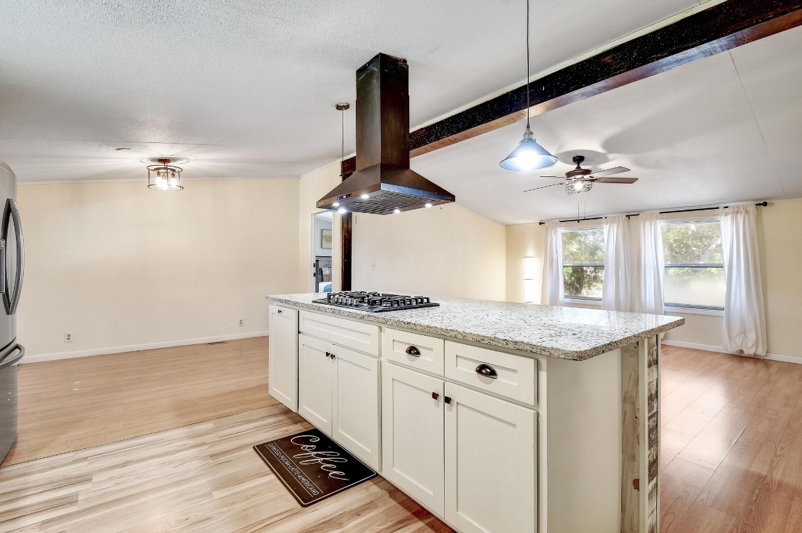 17398 Benton City Road Von Ormy, TX 78073 - Photo 11 of 25 a kitchen with stainless steel appliances granite countertop a sink stove and refrigerator