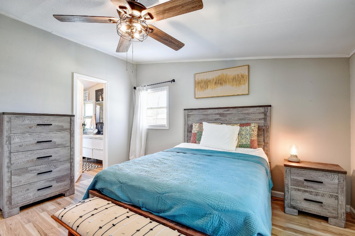 17398 Benton City Road Von Ormy, TX 78073 - Photo 13 of 25 a bedroom with a bed and a dresser