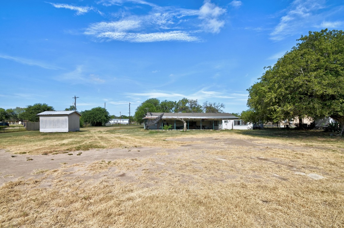17398 Benton City Road Von Ormy, TX 78073 - Photo 25 of 25 a front view of a house with a yard and trees