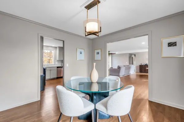 a view of a dining room with furniture and wooden floor