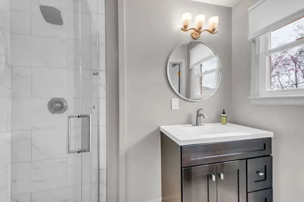 a bathroom with a sink and a mirror