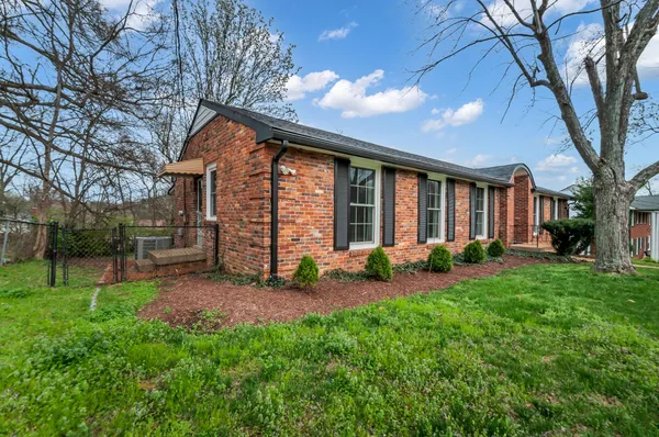 a view of a house with backyard porch and garden