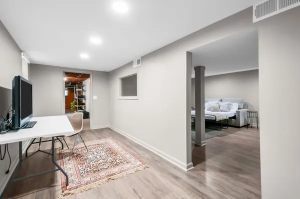 a workspace with furniture and view of living room